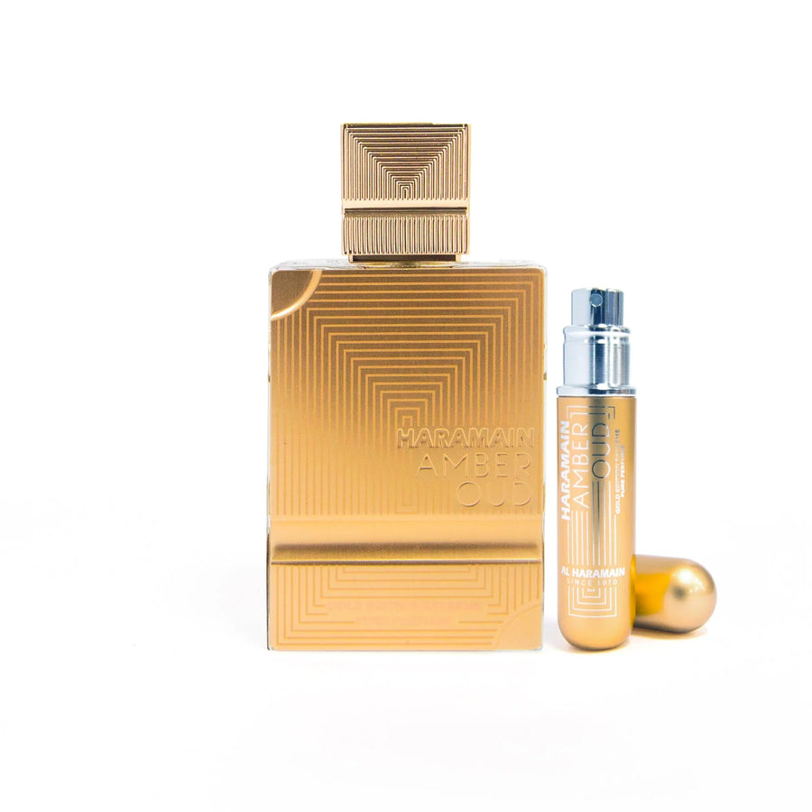 Al Haramain Amber Oud Extreme Gold Edition Extrait de Parfum – bottle with gold travel atomiser on a white background