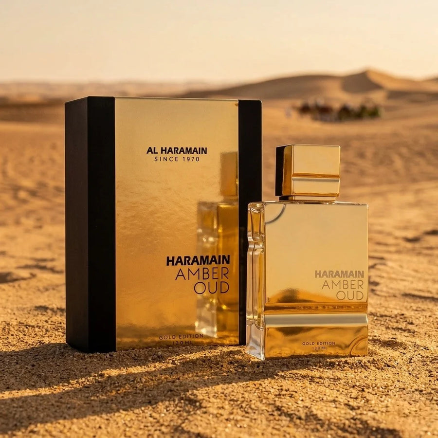 Al Haramain Amber Oud Gold Edition Eau de Parfum – bottle and box on desert sand