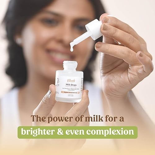 Vilvah Everyday Skincare Milk Kit – model holding the Milk Drops dropper bottle