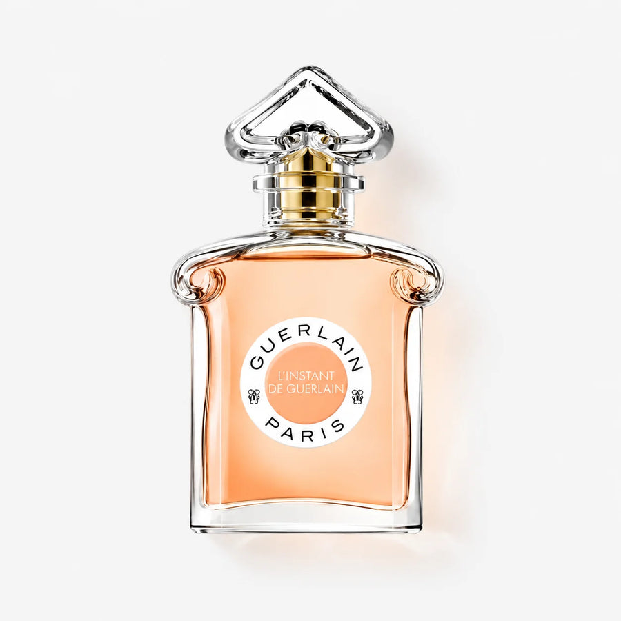Guerlain L’Instant de Guerlain Eau de Parfum 75ml – bottle with orange label, front view on a light background