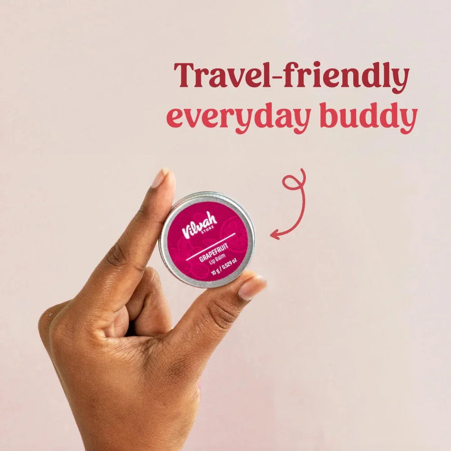 Vilvah Grape Fruit Lip Balm 10g – fingers holding the small travel-size tin