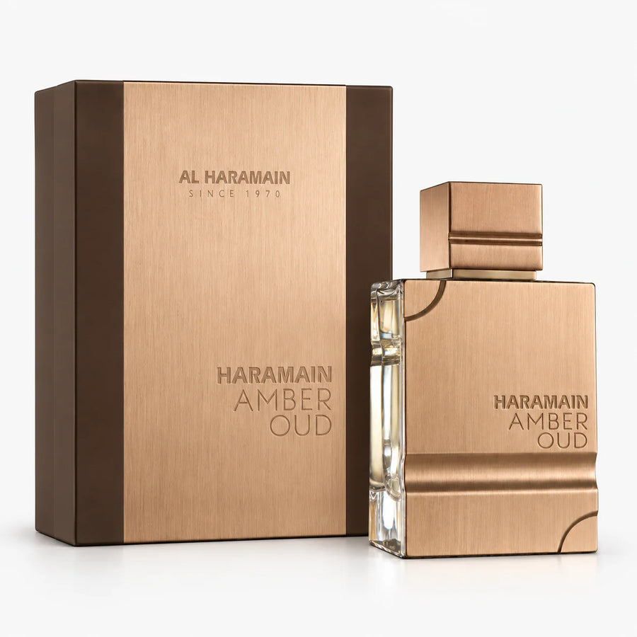 Al Haramain Amber Oud Eau de Parfum 60ml – bottle beside its brown and rose-gold box