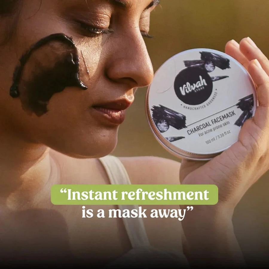 Vilvah Charcoal Face Mask 100ml – model with mask on her cheek holding the tin