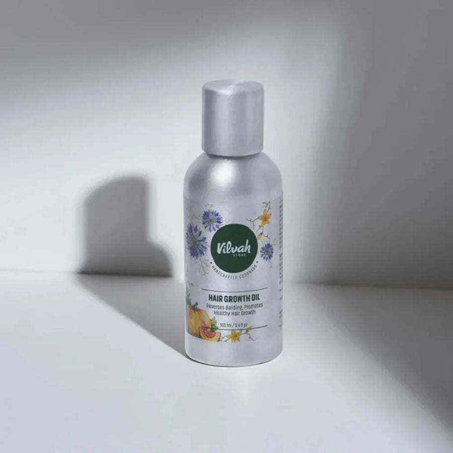 Vilvah Hair Growth Oil – aluminium bottle of hair growth oil on a white surface