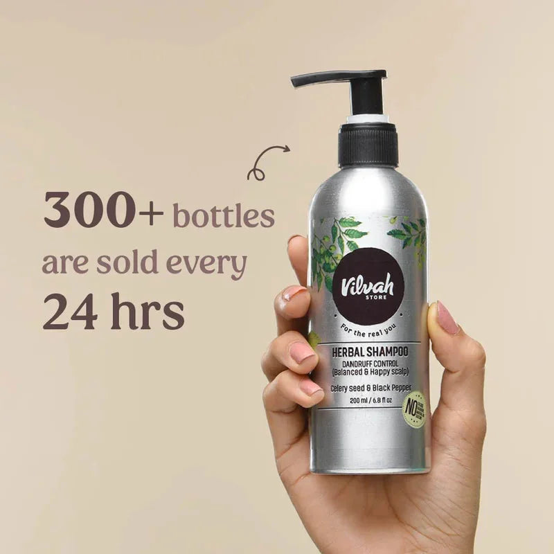 Vilvah Herbal Shampoo for Dandruff Control – hand holding the bottle, bottles sold per day