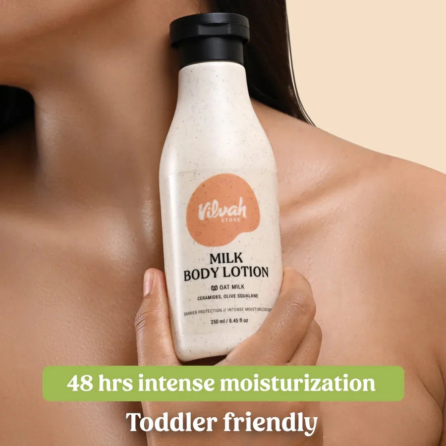 Vilvah Milk Body Lotion 250ml – model holding the lotion bottle against her shoulder