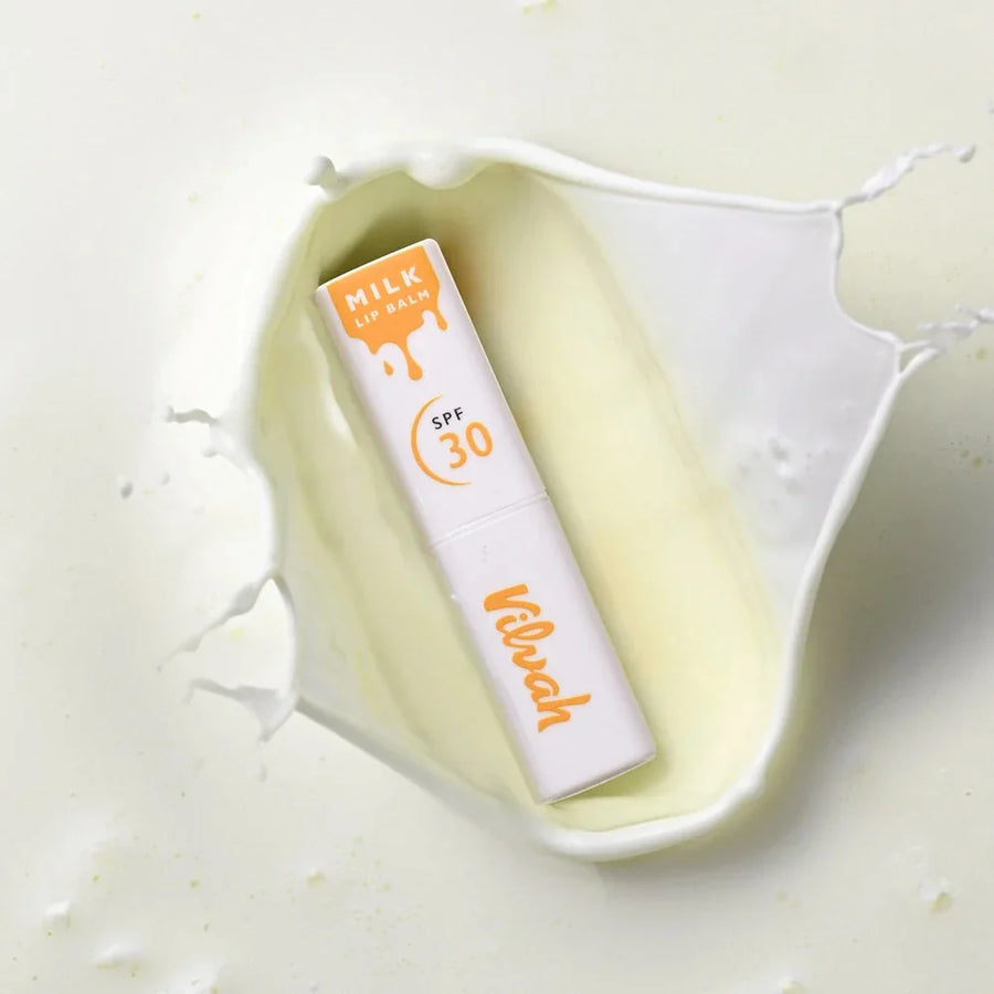 Vilvah Milk Lip Balm SPF 30 PA+++ – white lip balm stick in a milk splash