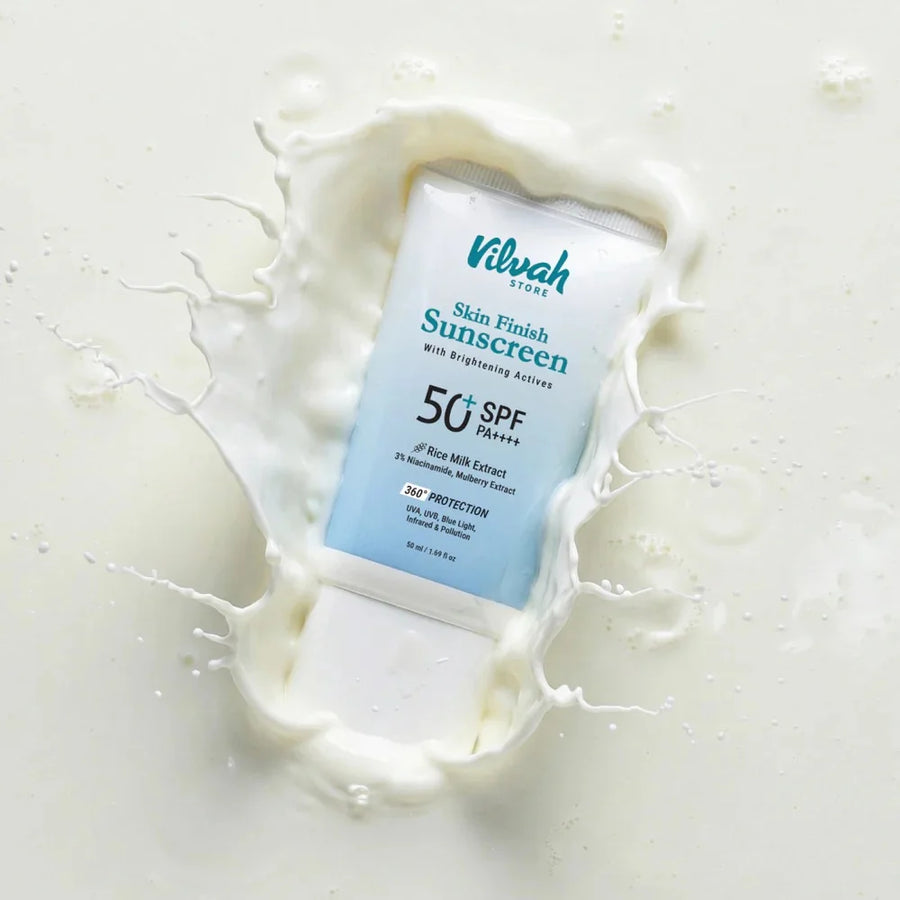 Vilvah Skin Finish Sunscreen SPF 50 PA+++ – blue tube in a milk splash